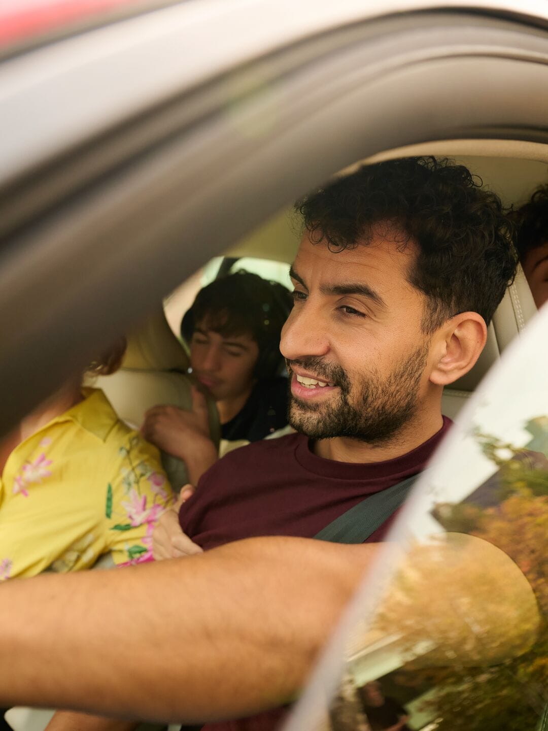 Man with his son (on the back seat, up to 15 years old) in the car