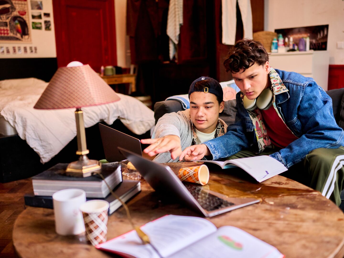 students that are studying in a room with books