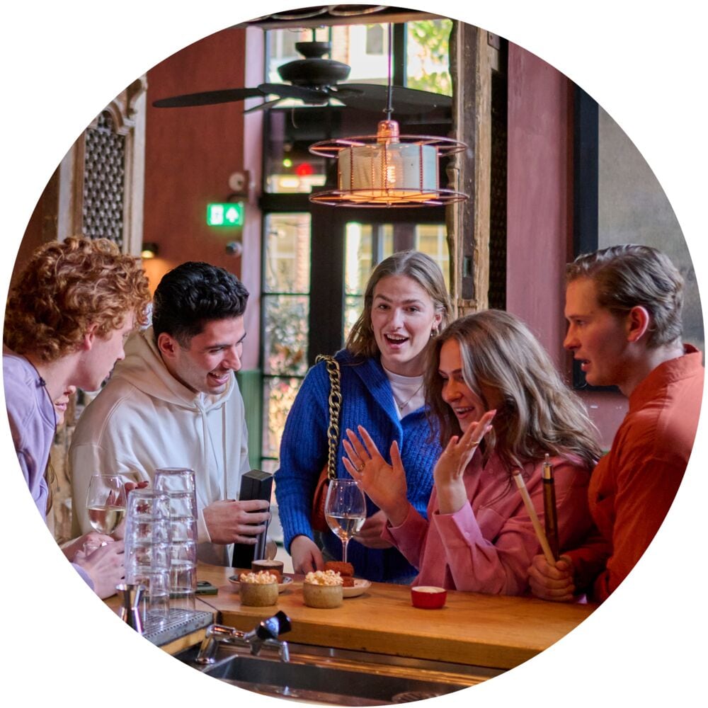 Students drinking, sitting and having fun in a cafe