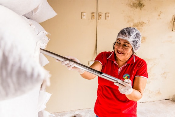 female worker processing beans
