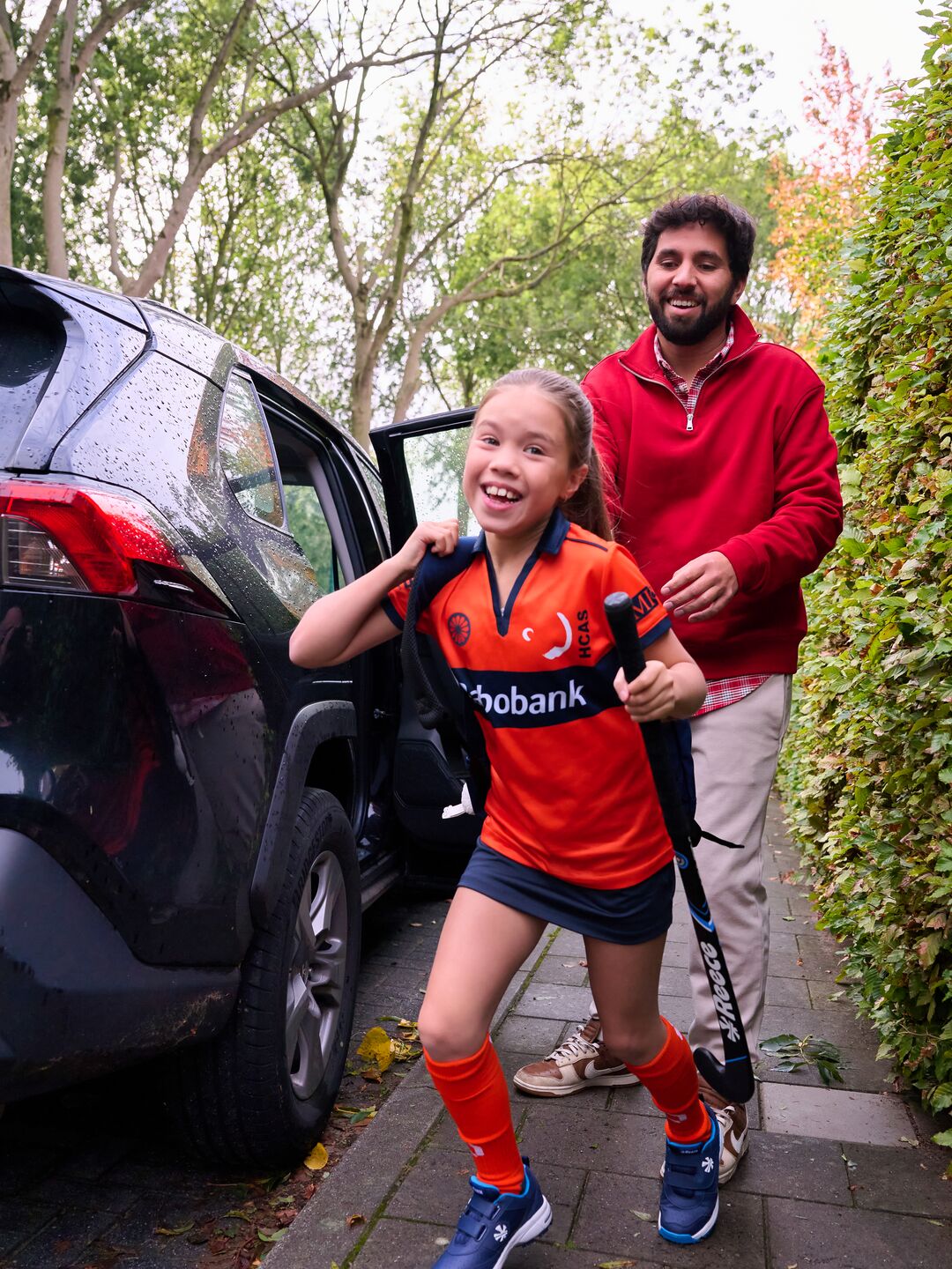 Father and daughter come home from hockey