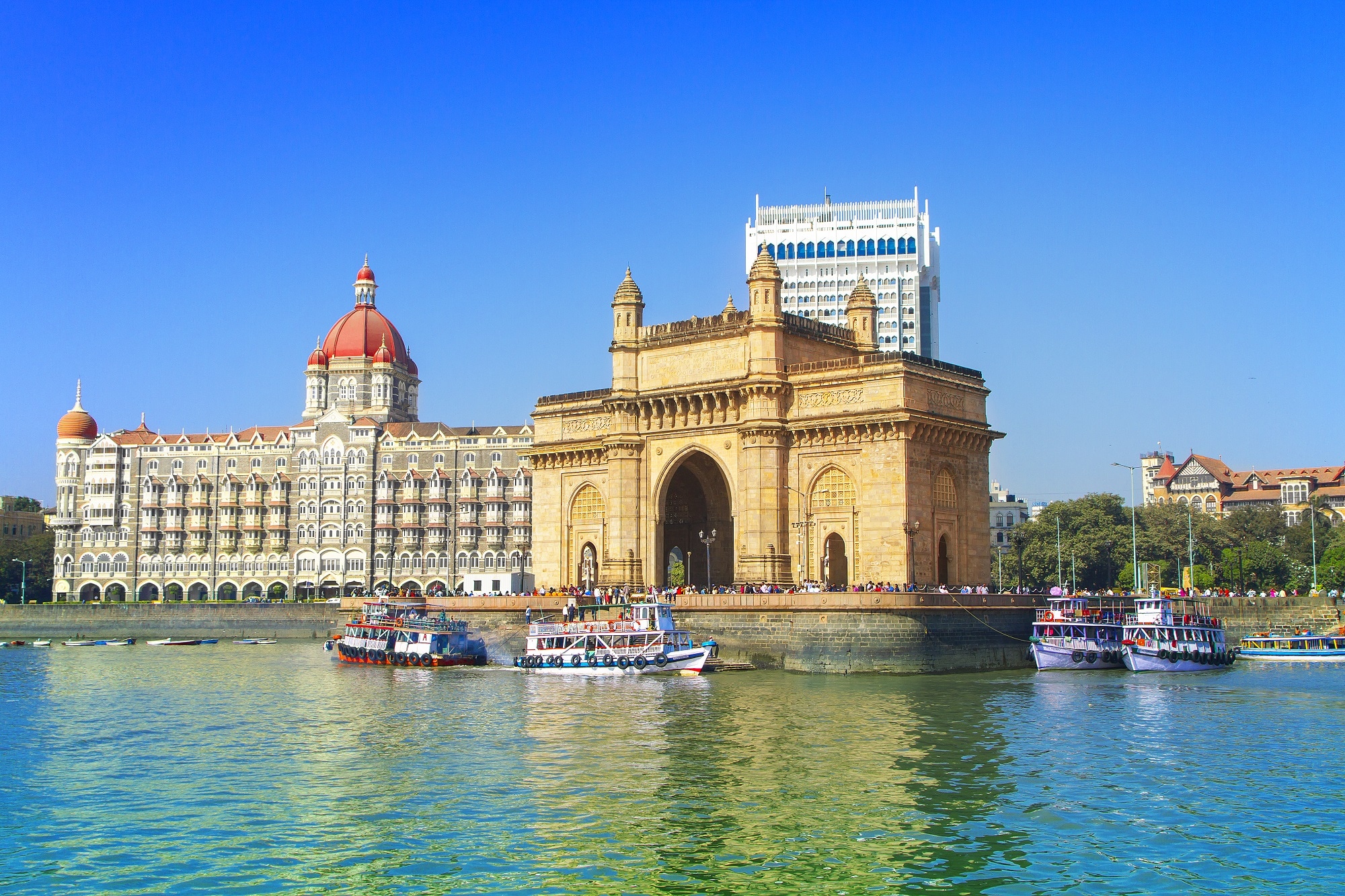 The Gateway of India and boats as seen from the Mumbai Harbour in Mumbai, India